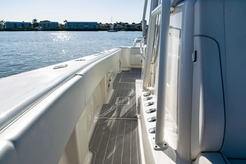  Yacht Photos Pics 2020 SeaVee 370z boat deck with sleek design, docked by calm waters.