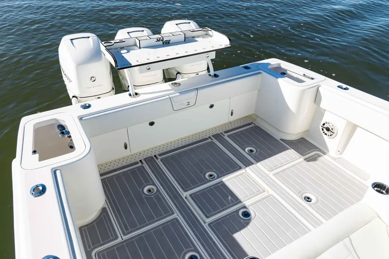  Yacht Photos Pics 2020 SeaVee 370z boat deck with triple outboard engines on calm water.