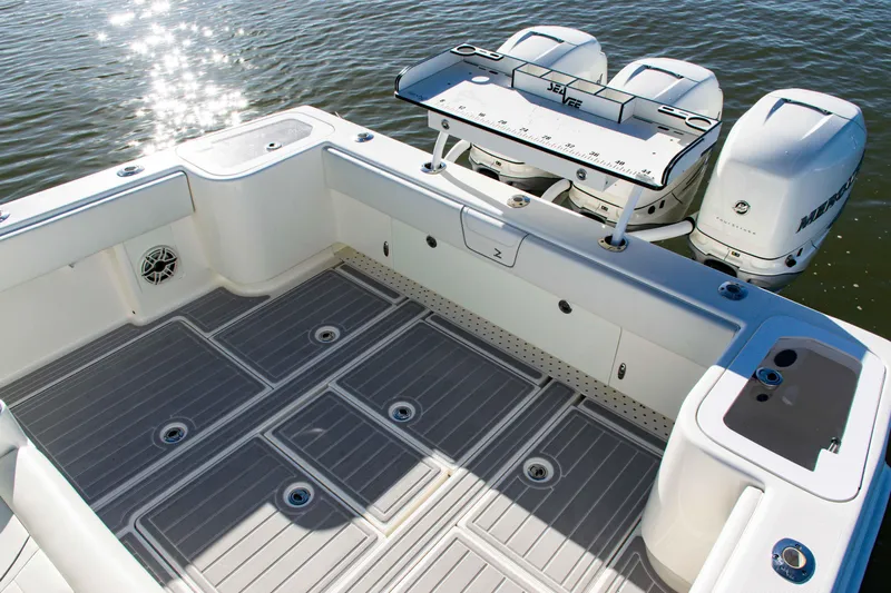  Yacht Photos Pics 2020 SeaVee 370z boat deck with triple outboard engines on calm water.