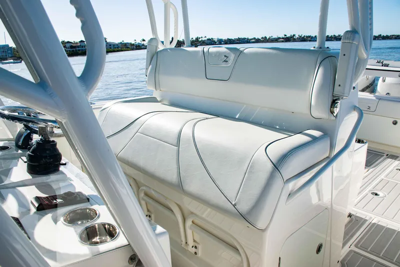  Yacht Photos Pics 2020 SeaVee 370z boat interior with white cushioned seating and cup holders.