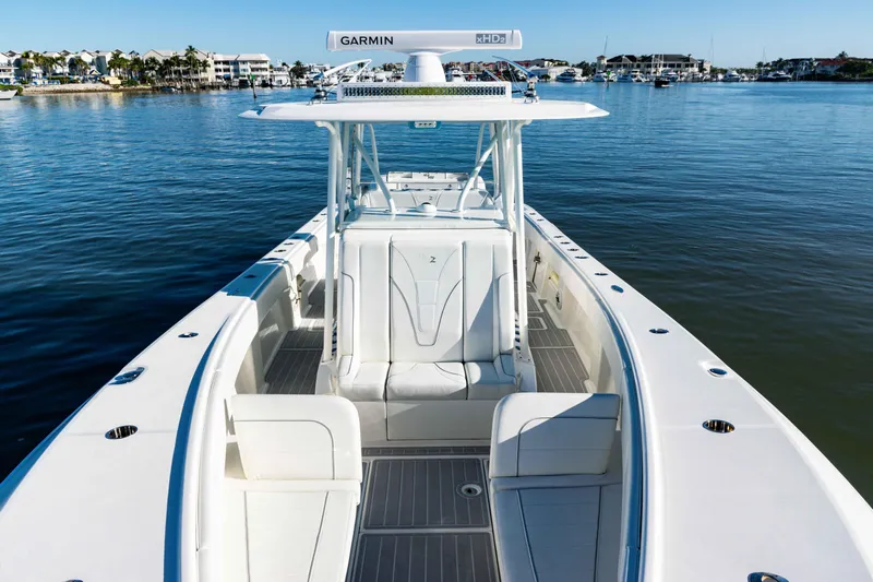  Yacht Photos Pics 2020 SeaVee 370z boat on calm water, featuring spacious deck and Garmin equipment.
