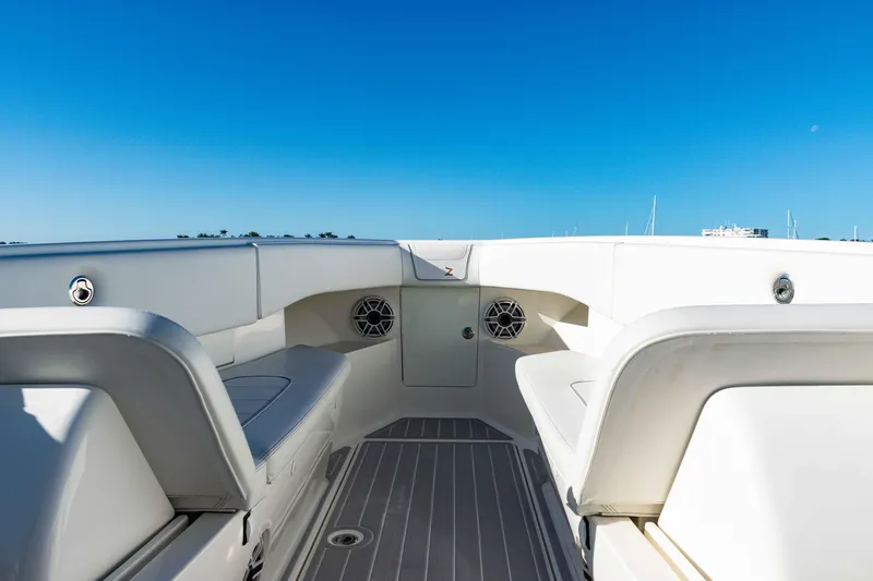  Yacht Photos Pics 2020 SeaVee 370z boat interior with seating and speakers under a clear blue sky.