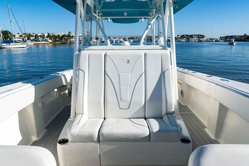  Yacht Photos Pics 2020 SeaVee 370z boat interior with white seating, docked in a marina.