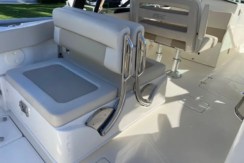  Yacht Photos Pics 2024 Boston Whaler 320 Vantage interior seating with sleek design and chrome accents.