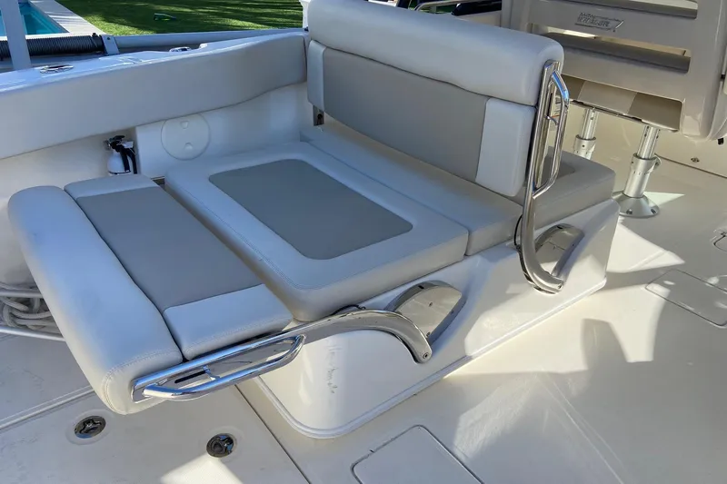  Yacht Photos Pics 2024 Boston Whaler 320 Vantage boat seating area with cushioned seats and stainless steel handles.