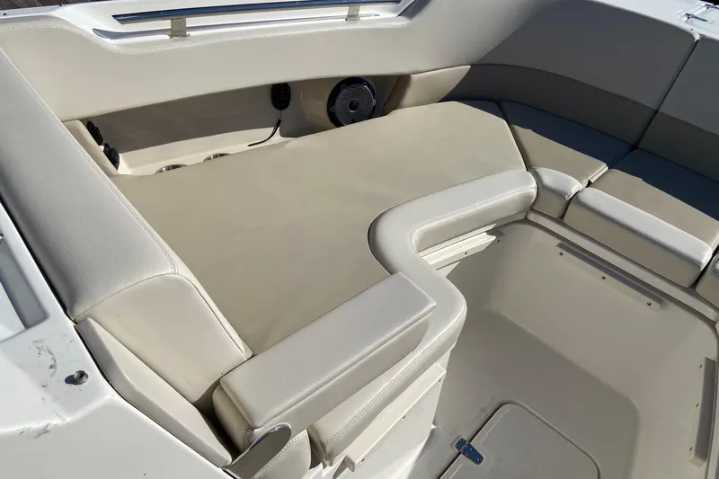  Yacht Photos Pics 2024 Boston Whaler 320 Vantage interior seating area with beige upholstery.