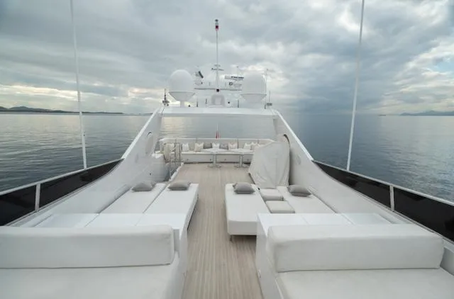  Yacht Photos Pics Luxurious Admiral 34m yacht deck, 2007 model, with elegant white seating and serene ocean view.
