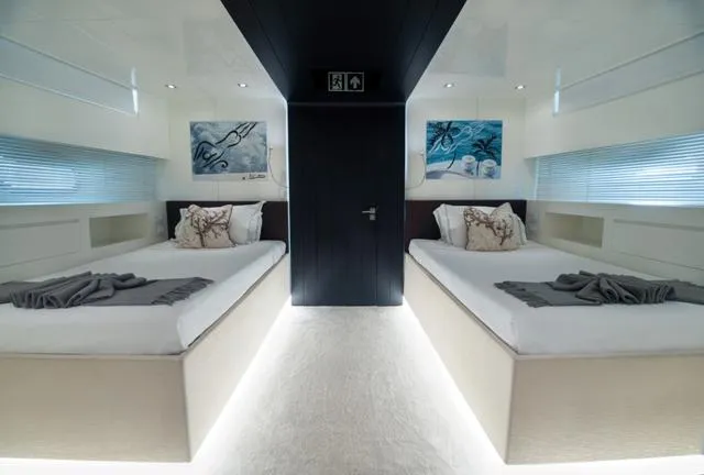  Yacht Photos Pics Luxurious twin bedroom on 2007 Admiral 34m yacht, featuring modern decor and ambient lighting.