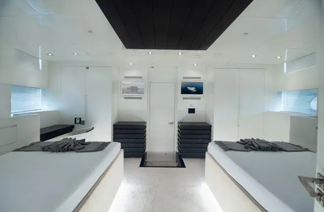  Yacht Photos Pics Luxurious Admiral 34m yacht interior, 2007 model, featuring modern twin beds and sleek design.