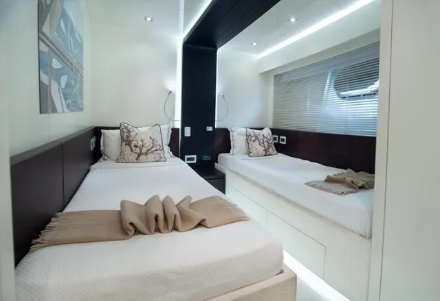  Yacht Photos Pics Luxurious twin bedroom on 2007 Admiral 34m yacht, featuring elegant decor and modern lighting.