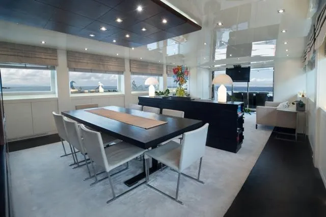  Yacht Photos Pics Luxurious dining area on a 2007 Admiral 34m yacht with modern decor and ocean views.