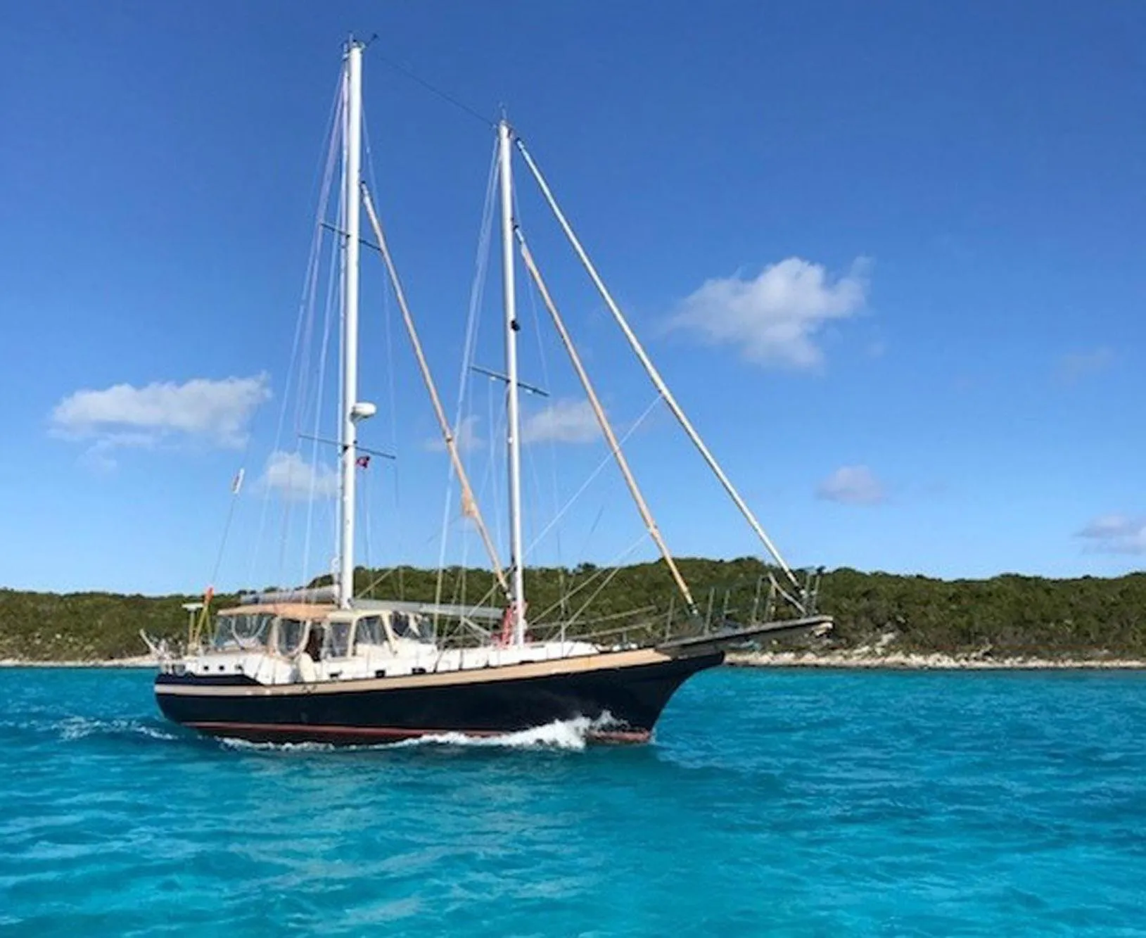 Custom 46 Dennis Schreibert Schooner sailing in clear blue waters, 2013 model.