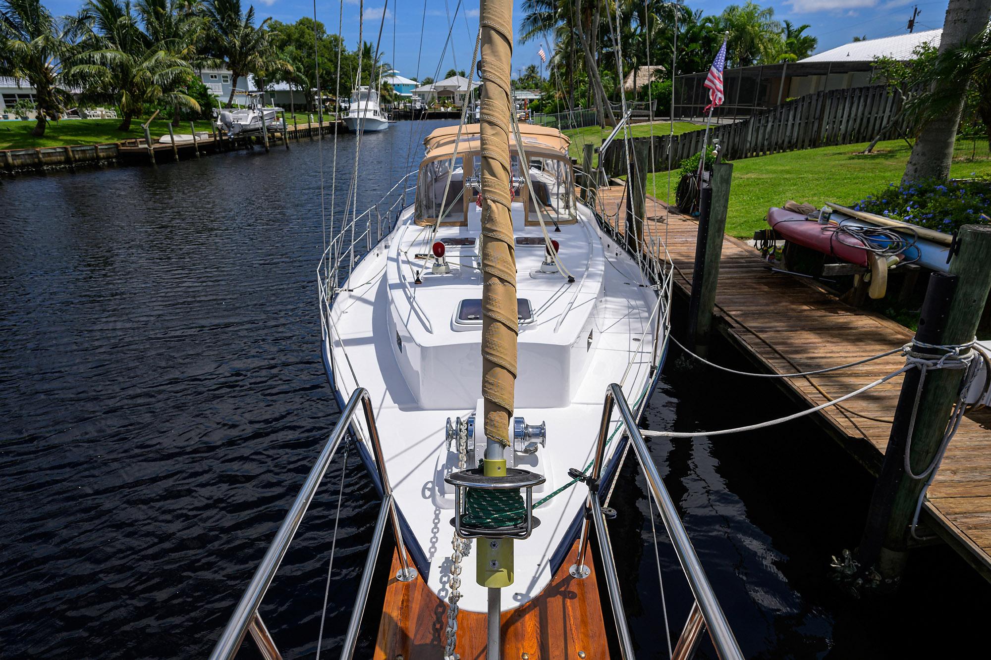 Custom 46 Dennis Schreibert Schooner, 2013, docked in a scenic canal setting.