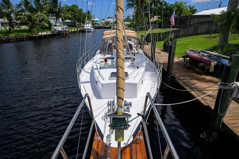 Running On Empty Yacht Photos Pics Custom 46 Dennis Schreibert Schooner, 2013, docked in a scenic canal setting.