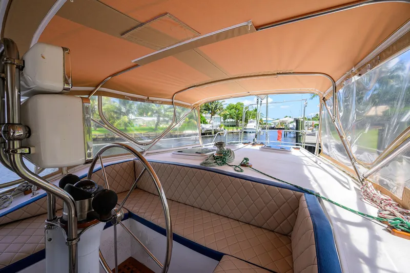 Running On Empty Yacht Photos Pics Interior view of 2013 Custom 46 Dennis Schreibert Schooner with steering wheel and seating.