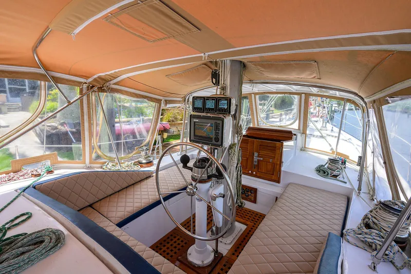 Running On Empty Yacht Photos Pics Interior of 2013 Custom 46 Dennis Schreibert Schooner with helm, navigation equipment, and seating.