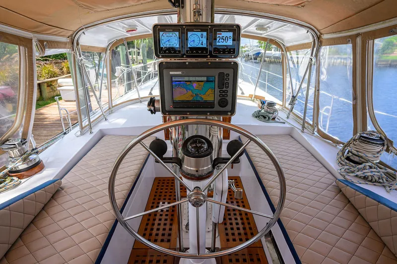 Running On Empty Yacht Photos Pics Cockpit of 2013 Custom 46 Dennis Schreibert Schooner with navigation equipment and steering wheel.