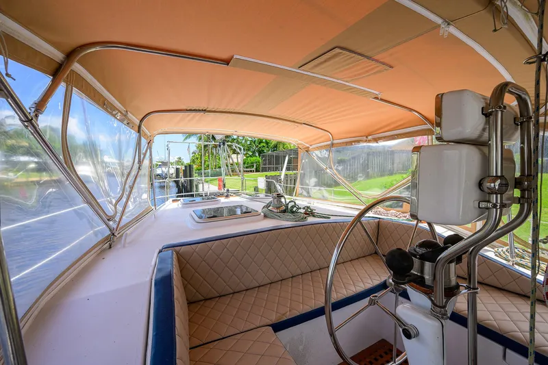 Running On Empty Yacht Photos Pics Interior view of 2013 Custom 46 Dennis Schreibert Schooner with seating and steering wheel.