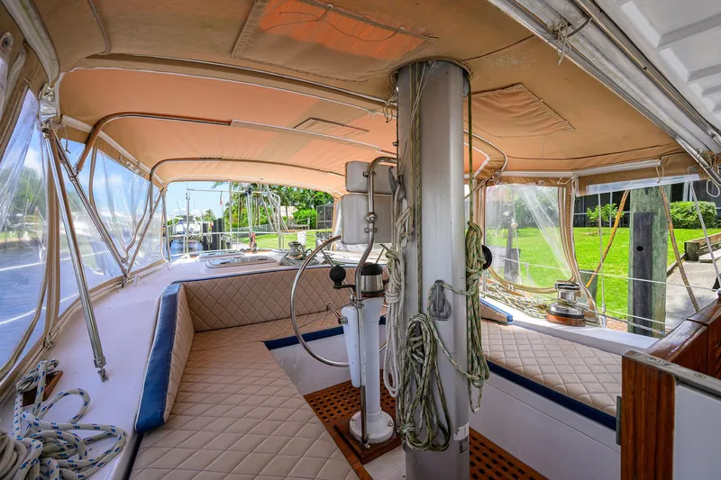 Running On Empty Yacht Photos Pics Interior view of 2013 Custom 46 Dennis Schreibert Schooner with cushioned seating and helm.