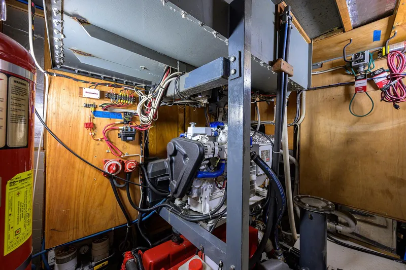 Running On Empty Yacht Photos Pics Engine room of 2013 Custom 46 Dennis Schreibert Schooner with visible wiring and machinery.