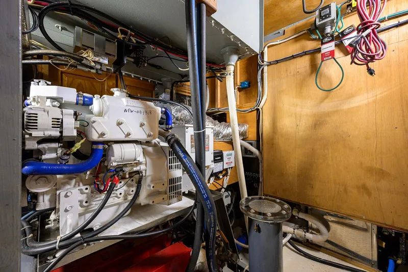 Running On Empty Yacht Photos Pics Engine room of 2013 Custom 46 Dennis Schreibert Schooner, showcasing mechanical components and wiring.