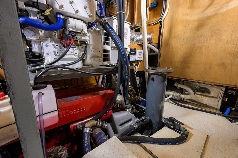 Running On Empty Yacht Photos Pics Engine room of 2013 Custom 46 Dennis Schreibert Schooner with visible machinery and piping.