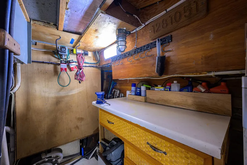Running On Empty Yacht Photos Pics Workshop area inside 2013 Custom 46 Dennis Schreibert Schooner, featuring tools and storage.