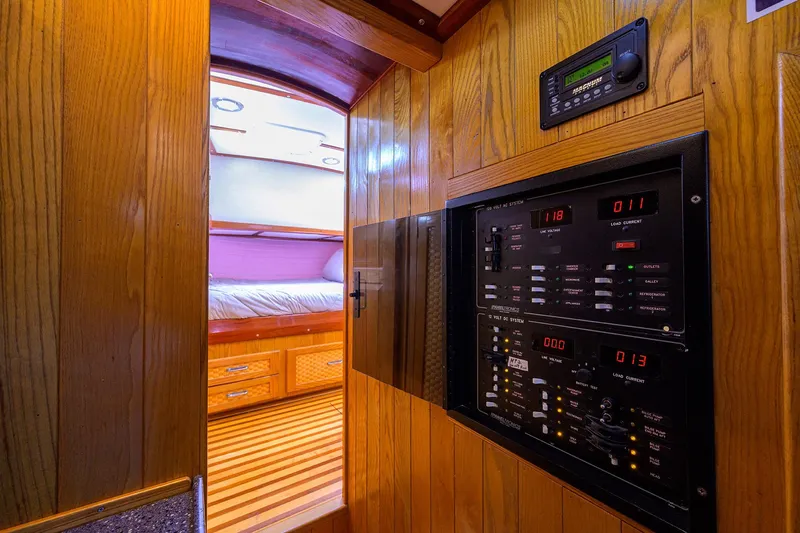 Running On Empty Yacht Photos Pics Interior of 2013 Custom 46 Dennis Schreibert Schooner with control panel and cozy cabin.