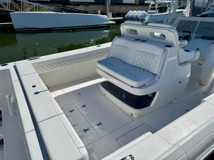  Yacht Photos Pics 2017 Intrepid 375 Center Console boat interior with white seating and storage.