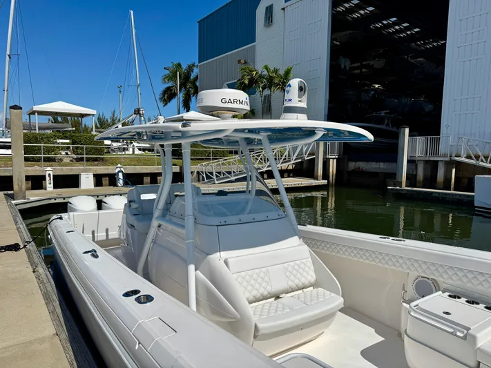 Yacht Photos Pics 2017 Intrepid 375 Center Console boat docked near marina with clear blue sky.