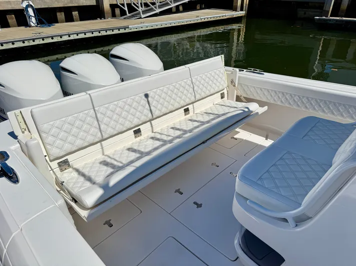  Yacht Photos Pics 2017 Intrepid 375 Center Console with white quilted seating and triple outboard engines.