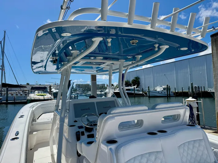  Yacht Photos Pics 2017 Intrepid 375 Center Console boat docked at marina, featuring sleek design and modern amenities.