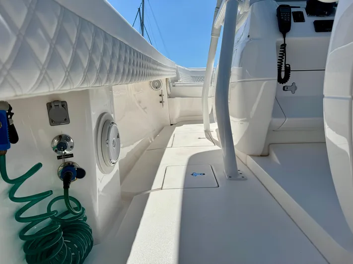  Yacht Photos Pics 2017 Intrepid 375 Center Console boat interior with white seating and marine equipment.