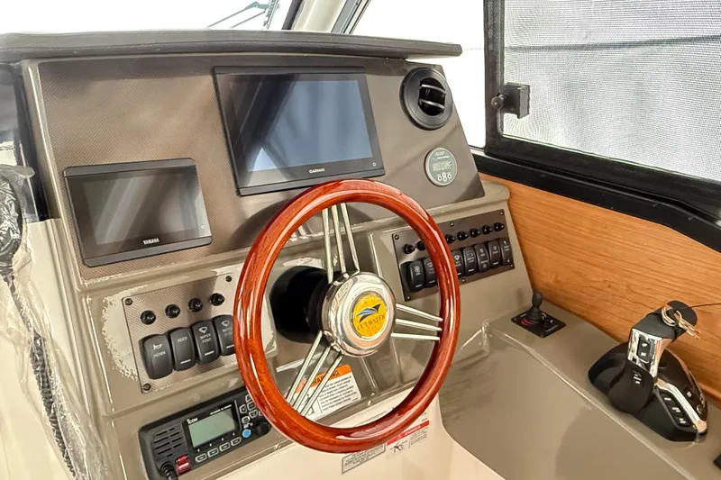  Yacht Photos Pics 2026 Cutwater C-248 Coupe dashboard with steering wheel, digital displays, and control panel.