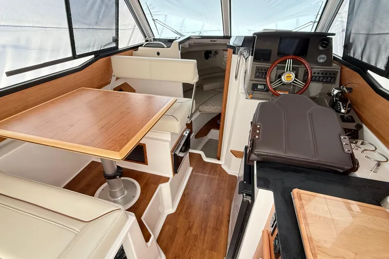  Yacht Photos Pics Interior of 2026 Cutwater C-248 Coupe boat with modern helm and seating area.