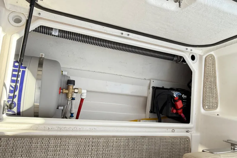  Yacht Photos Pics 2026 Cutwater C-248 Coupe engine compartment with water heater and battery system.