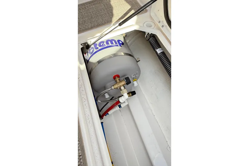  Yacht Photos Pics 2026 Cutwater C-248 Coupe interior showing a water heater system installation.