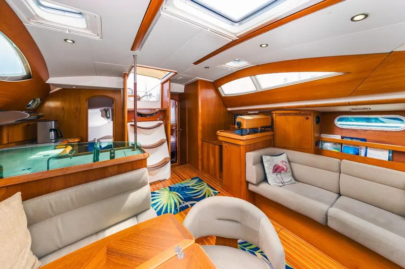 Maka Le'a Yacht Photos Pics Luxurious 2006 Jeanneau DS yacht interior with elegant wood finish and modern amenities.