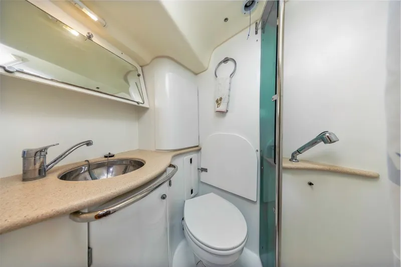 Maka Le'a Yacht Photos Pics 2006 Jeanneau DS yacht bathroom with sink, toilet, and shower.