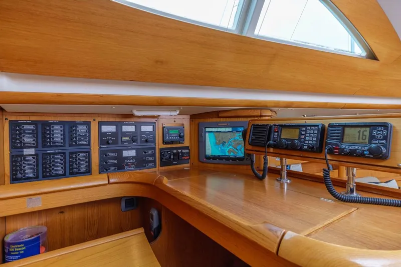 Maka Le'a Yacht Photos Pics 2006 Jeanneau DS yacht navigation panel with electronic controls and communication devices.
