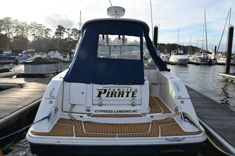 Pamlico Pirate Yacht Photos Pics 2008 Sea Ray 350 Sundancer docked, featuring blue canopy.