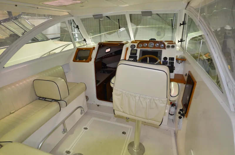Able II Yacht Photos Pics 2008 Hunt Yachts Surfhunter 29 interior with helm, seating, and navigation equipment.