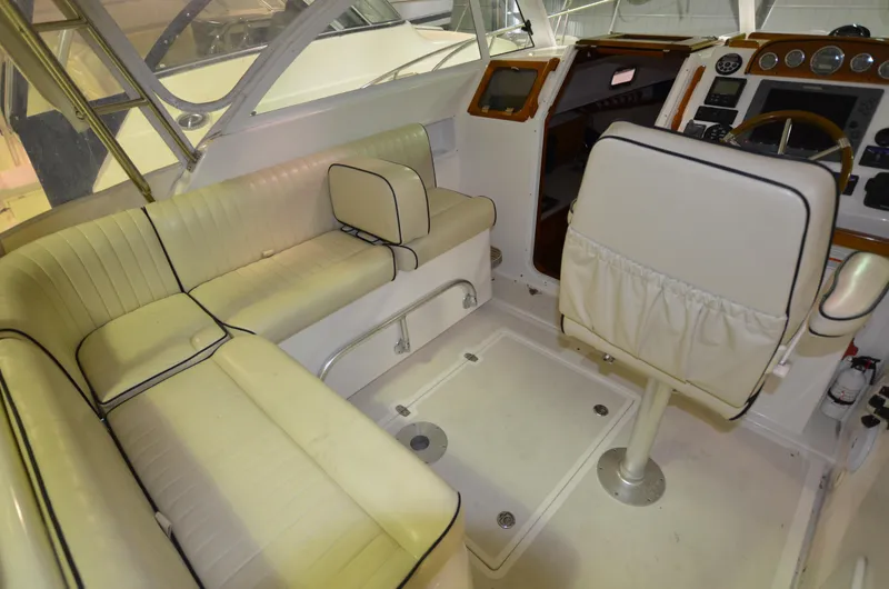 Able II Yacht Photos Pics 2008 Hunt Yachts Surfhunter 29 interior with white seating and helm station.