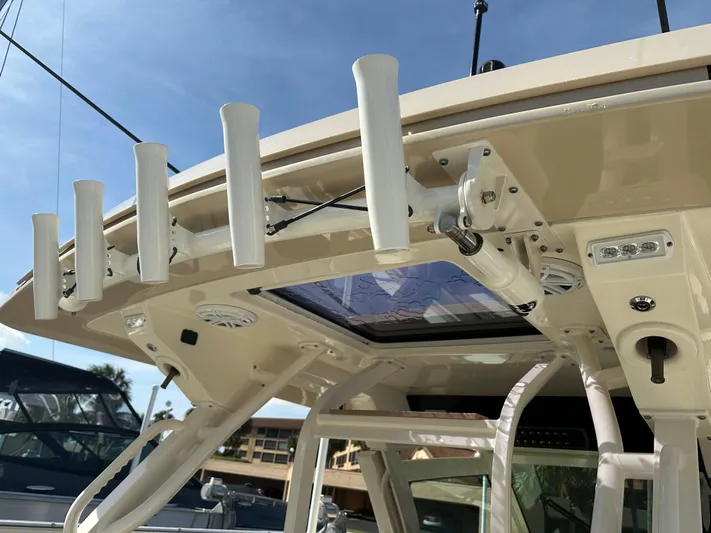  Yacht Photos Pics 2019 Scout 380 LXF boat with rod holders and sunroof detail.
