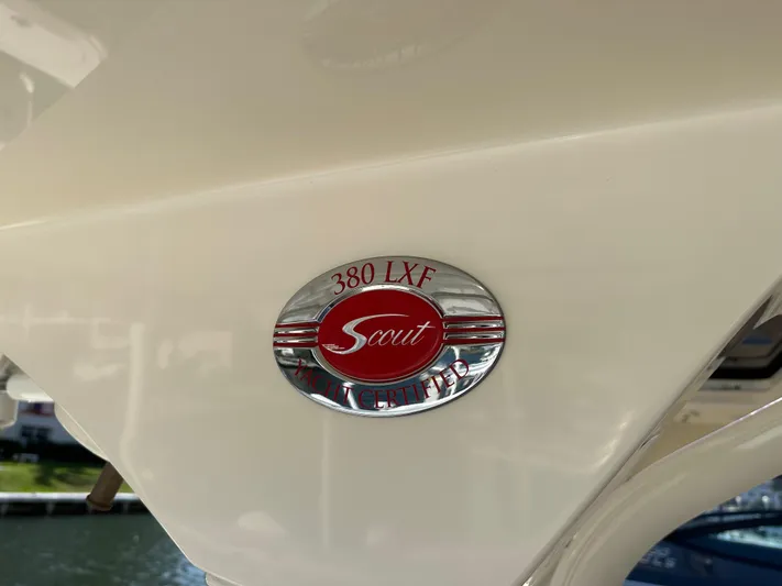  Yacht Photos Pics 2019 Scout 380 LXF boat emblem, featuring a red and silver design.