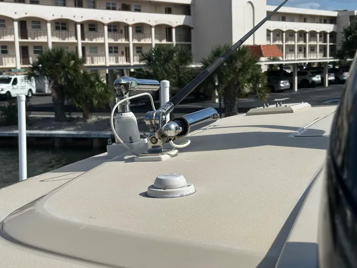  Yacht Photos Pics 2019 Scout 380 LXF boat deck with chrome fittings and antenna, dockside view.