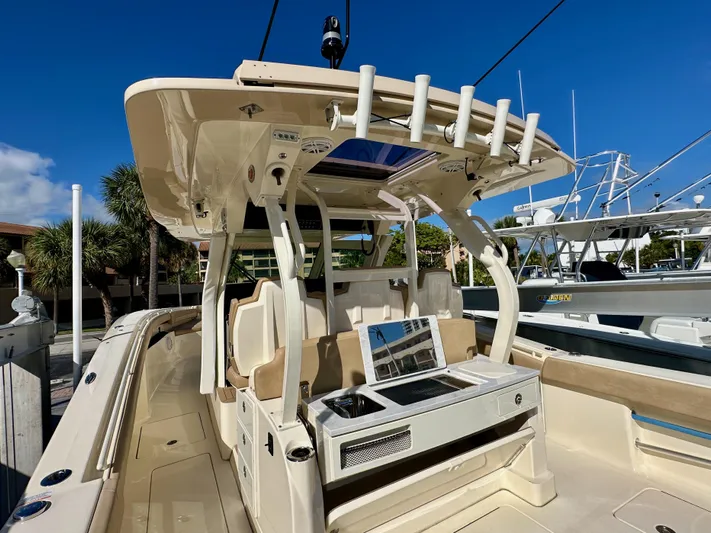  Yacht Photos Pics 2019 Scout 380 LXF boat interior with seating and fishing rod holders.
