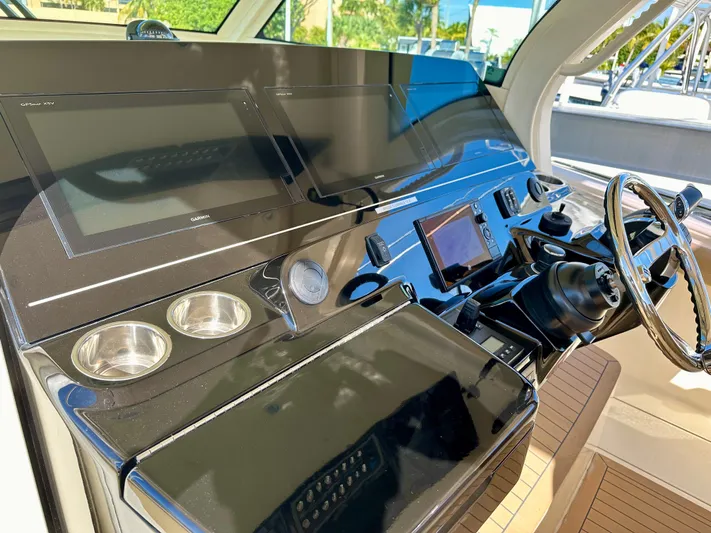  Yacht Photos Pics Helm of 2019 Scout 380 LXF boat with modern controls and steering wheel.