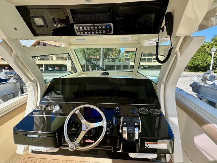  Yacht Photos Pics 2019 Scout 380 LXF boat helm with modern controls and steering wheel.