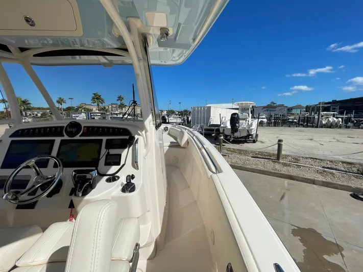  Yacht Photos Pics Grady-White Canyon 326 boat 2023 at dock with blue sky.